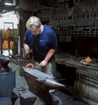 The German farrier Christoph Schweppe forging a horseshoe