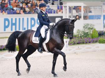 Ingrid Klimke rides in a dressage contest, Chio, 20 June 2013